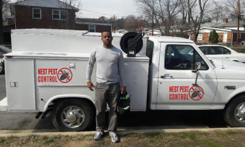 James Arrives in his white truck to inspect a Bethesda MD house for pest control